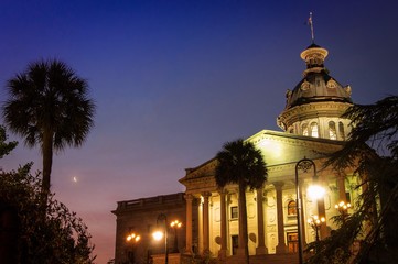 South Carolina Capital Building at sunrise with crescent moon and palmetto trees