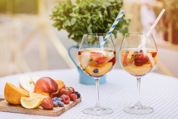 Top view of summer dinks, fruit cocktails on white wood table wi