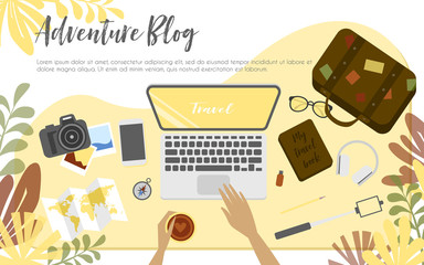 Workplace of travel blogger, view from above, desktop, suitcase for adventure, compass, map and arms