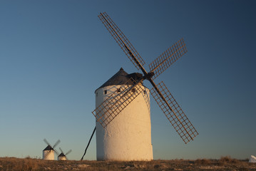 Naklejka premium Windmills, Wind energy, Nocturnal Campo de Criptana, Ciudad Real, Spain