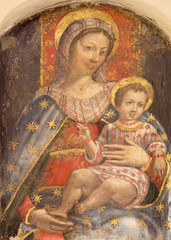 PARMA, ITALY - APRIL 16, 2018:  The fresco of Madonna with the child in church Chiesa di San Benetetto by unknown artist of 16. cent.