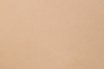 The blanket of furry orange fleece fabric. A background texture of light orange soft plush fleece...