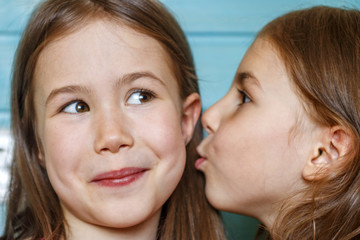 The girl shares her big secret with her best friend