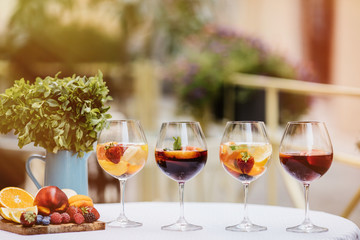 Top view of summer dinks, fruit cocktails on white wood table wi