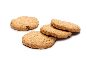 Round wholewheat biscuits with raisins isolated on white background