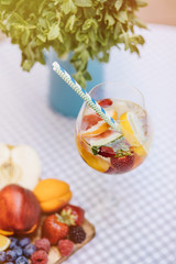 Top view of summer dinks, fruit cocktails on white wood table wi