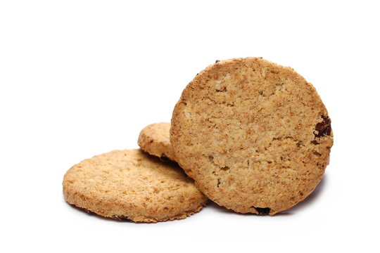 Round wholewheat biscuits with raisins isolated on white background