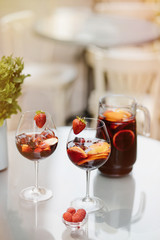 Top view of summer dinks, fruit cocktails on white wood table wi