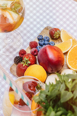 Top view of summer dinks, fruit cocktails on white wood table wi