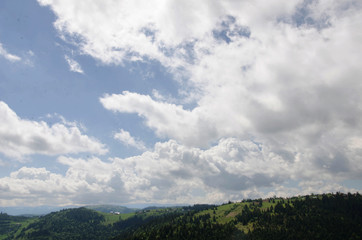 Naklejka premium Transylvanian mountains - cabin in the forest with cloudy blue sky