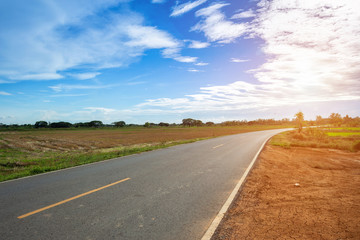Rural roads Beside with nature and tree big green in sky with white clouds.
