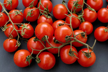 healthy vine tomatoes on the black back ground.
