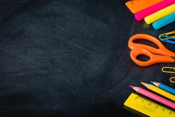 1 September, back to school or college flatlay with supplies on the blackboard, banner