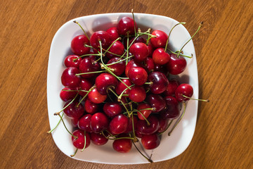 cherry in the plate on the table