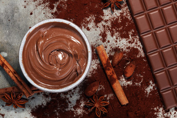 Chocolate bars on table with chocolate powder.