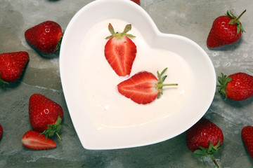 strawberry yogurt in bowl with fresh strawberries