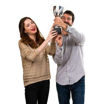 Young Couple Holding A Trophy