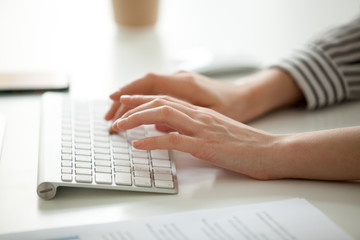Businesswoman working on computer concept, female hands typing text on keyboard, woman using desktop for writing business emails, communicating in corporate messenger, doing job online, close up view