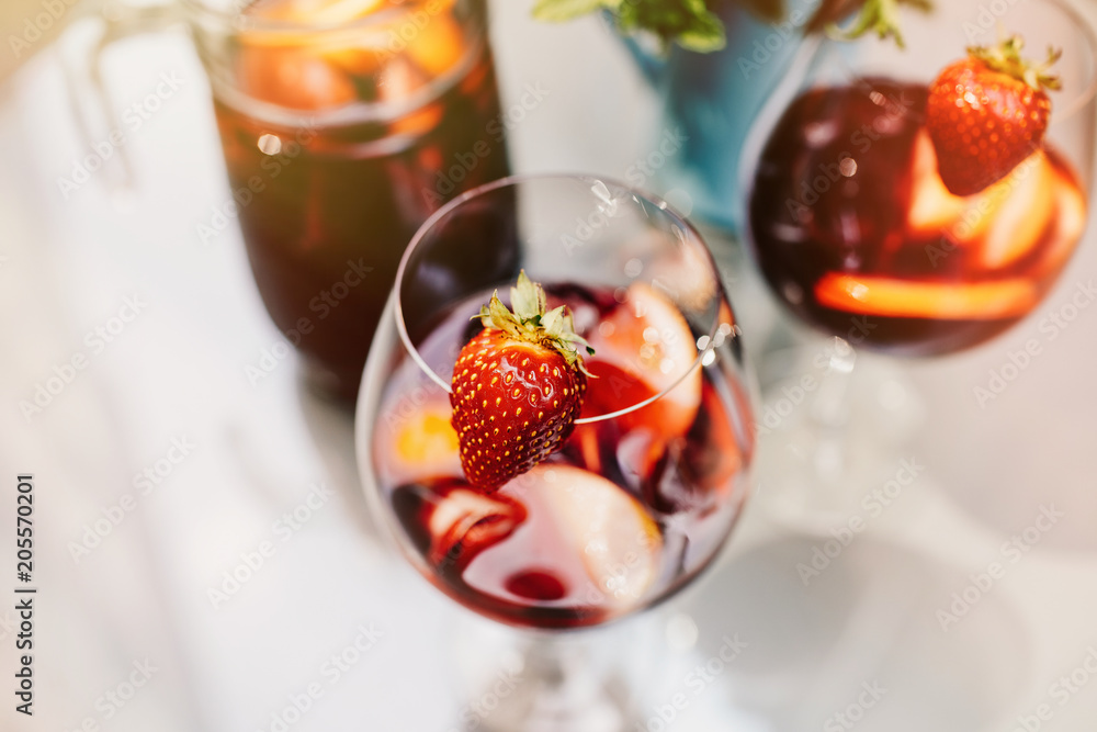 Wall mural top view of summer dinks, fruit cocktails on white wood table wi