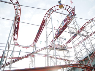Red roller coaster against the sky in Cologne