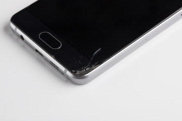 Rejected, cracked glass on a smartphone, close-up
