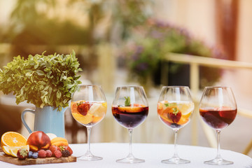 Top view of summer dinks, fruit cocktails on white wood table wi