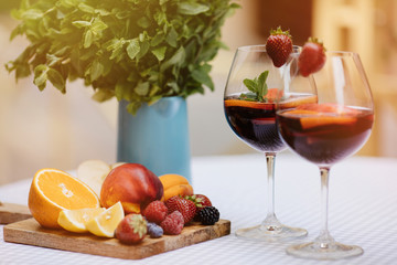 Top view of summer dinks, fruit cocktails on white wood table wi