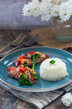 Sichuan pork, broccoli, red pepper and cashew stir-fry with rice