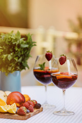 Top view of summer dinks, fruit cocktails on white wood table wi
