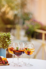 Top view of summer dinks, fruit cocktails on white wood table wi