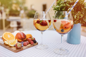 Top view of summer dinks, fruit cocktails on white wood table wi