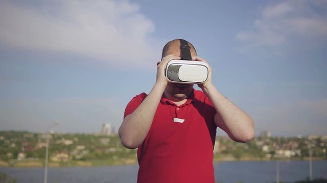 The man is boxing with the invisible enemy in virtual reality glasses XP 360