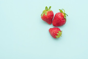 fresh strawberry on a blue background