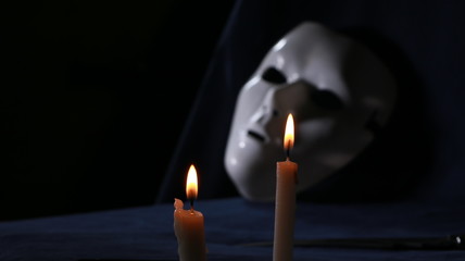 Close up of a white mystique mask 
