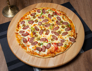 Pizza with sauce and sausages