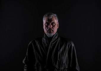 shadow portrait of a man, dark studio background