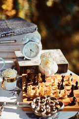 Holiday themed table for the tea ceremony. Table with sweets. Tea with sweets. Table of Alice in Wonderland