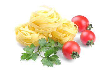 Fetuchini with several cherry tomatoes and a bunch of parsley. Isolated