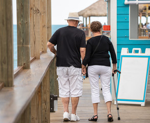 unknown senior couple happy growing old together and holding hands