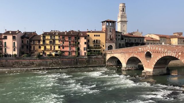 Riverbank with roman bridge in old town of Verona, Italy