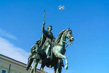 Equestrian statue of Ludwig I of Bavaria (1862) and flying drone quadrocopter, Munich, Germany
