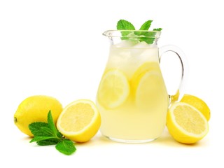 Jug of summer lemonade with lemons and mint isolated on a white background - obrazy, fototapety, plakaty