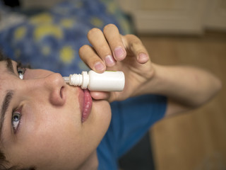 close up portrait of young boy drip in nose