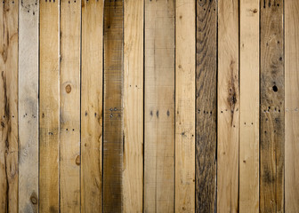 Old weathered wood surface with vertical boards lined up. Wooden planks on a wall or floor with...