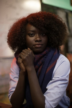 Woman, black, dark, dark skin, portrait, natural hair, sitting, indoor, African