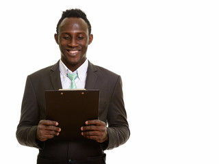 Young happy black African businessman smiling while reading on c