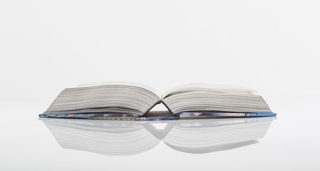 Opened book in a white background
