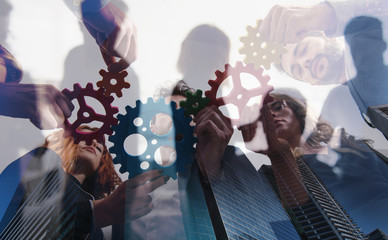 Business team connect pieces of gears. Teamwork, partnership and integration concept. double...