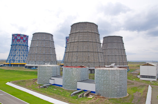 Territory of heat and power station. Accumulator tanks and cooling towers. Close-up.