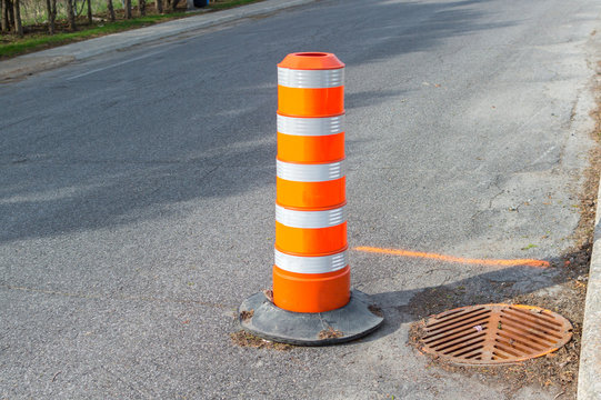 The orange traffic cone on the sidewalk in Montreal downtown, Canada